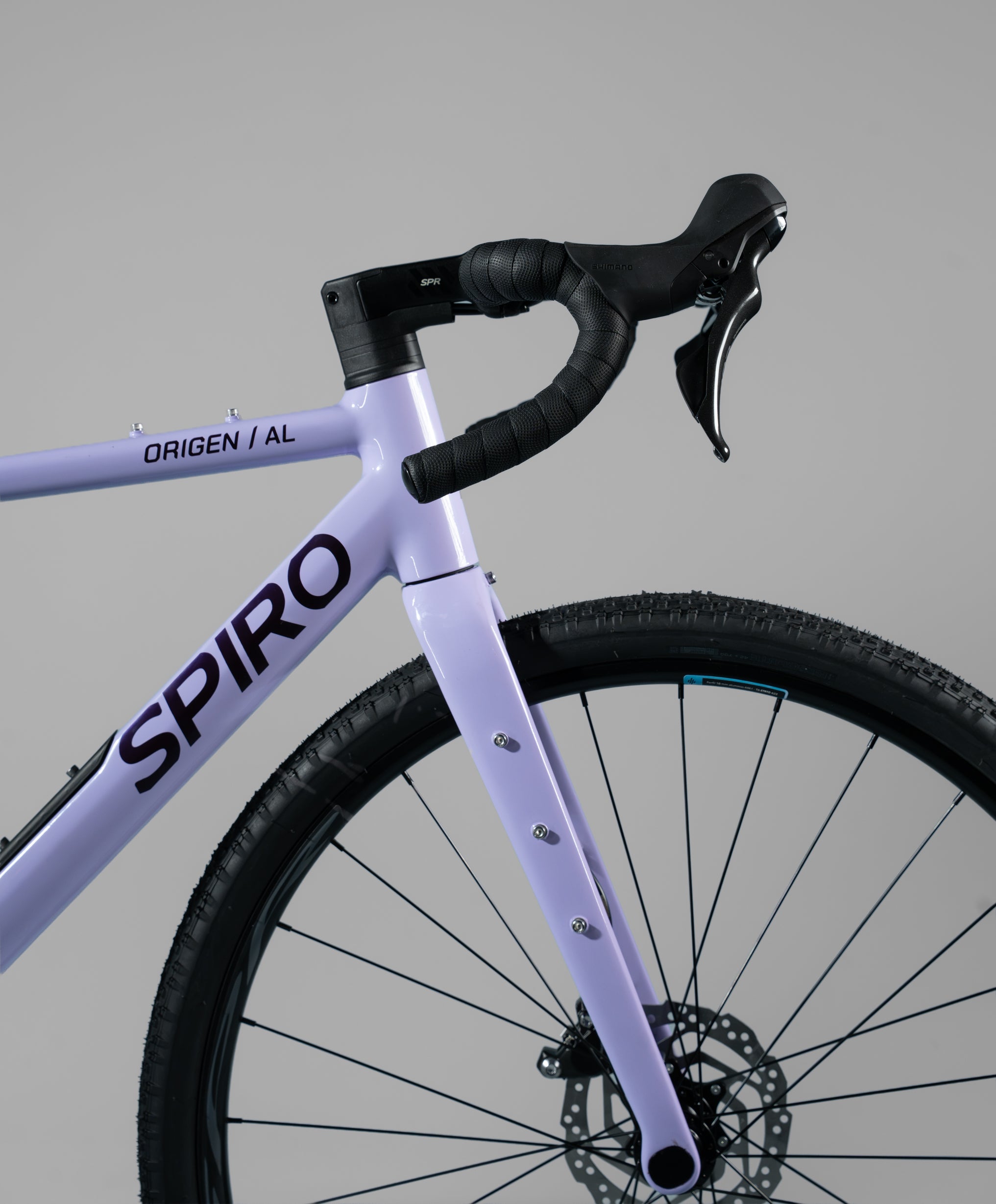 Bicicleta de gravel ORIGEN AL en aluminio y tenedor en carbono grupo Shimano Cues de 2x10 vel. Color Jugo de Mora en Leche