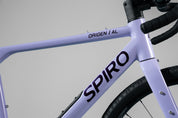Bicicleta de gravel ORIGEN AL en aluminio y tenedor en carbono grupo Shimano Cues de 2x10 vel. Color Jugo de Mora en Leche